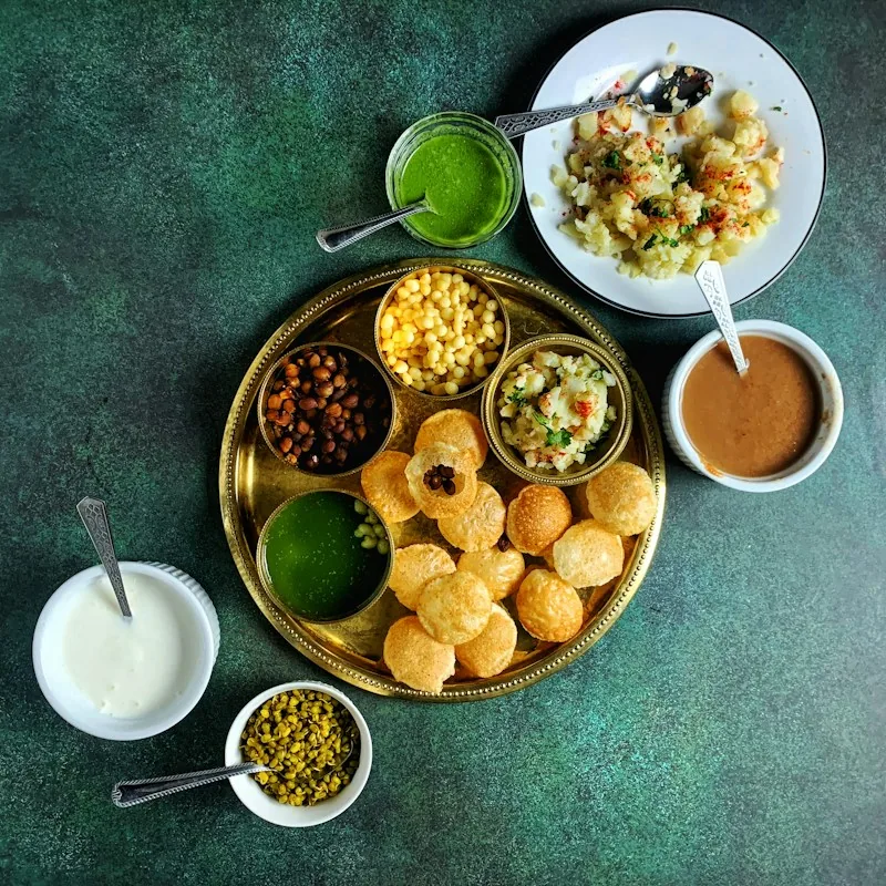 Platter of pani puri and chaat with chutneys